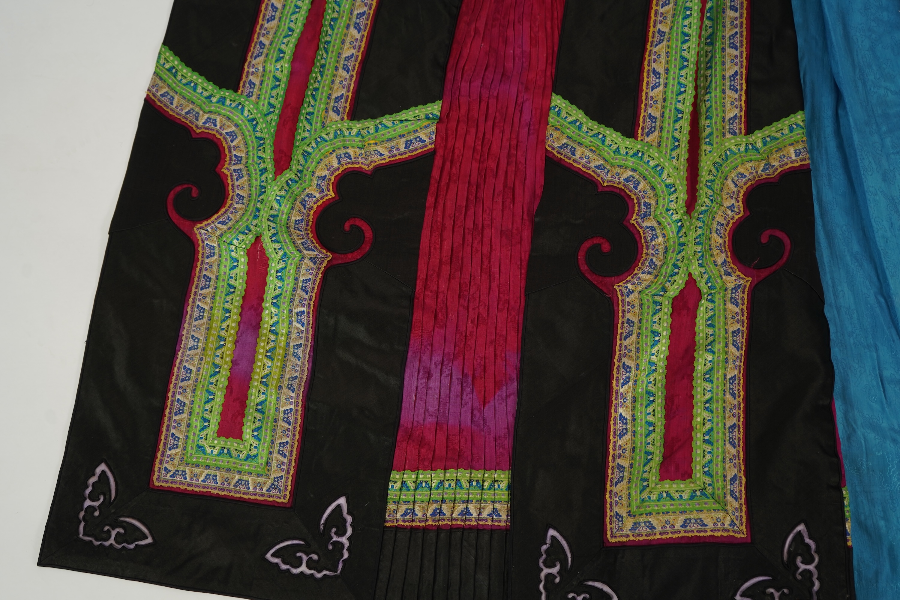 Two Chinese embroidered silk wedding skirts, late Qing, five hats, trousers, two skirt panels and two others, collar and a panel